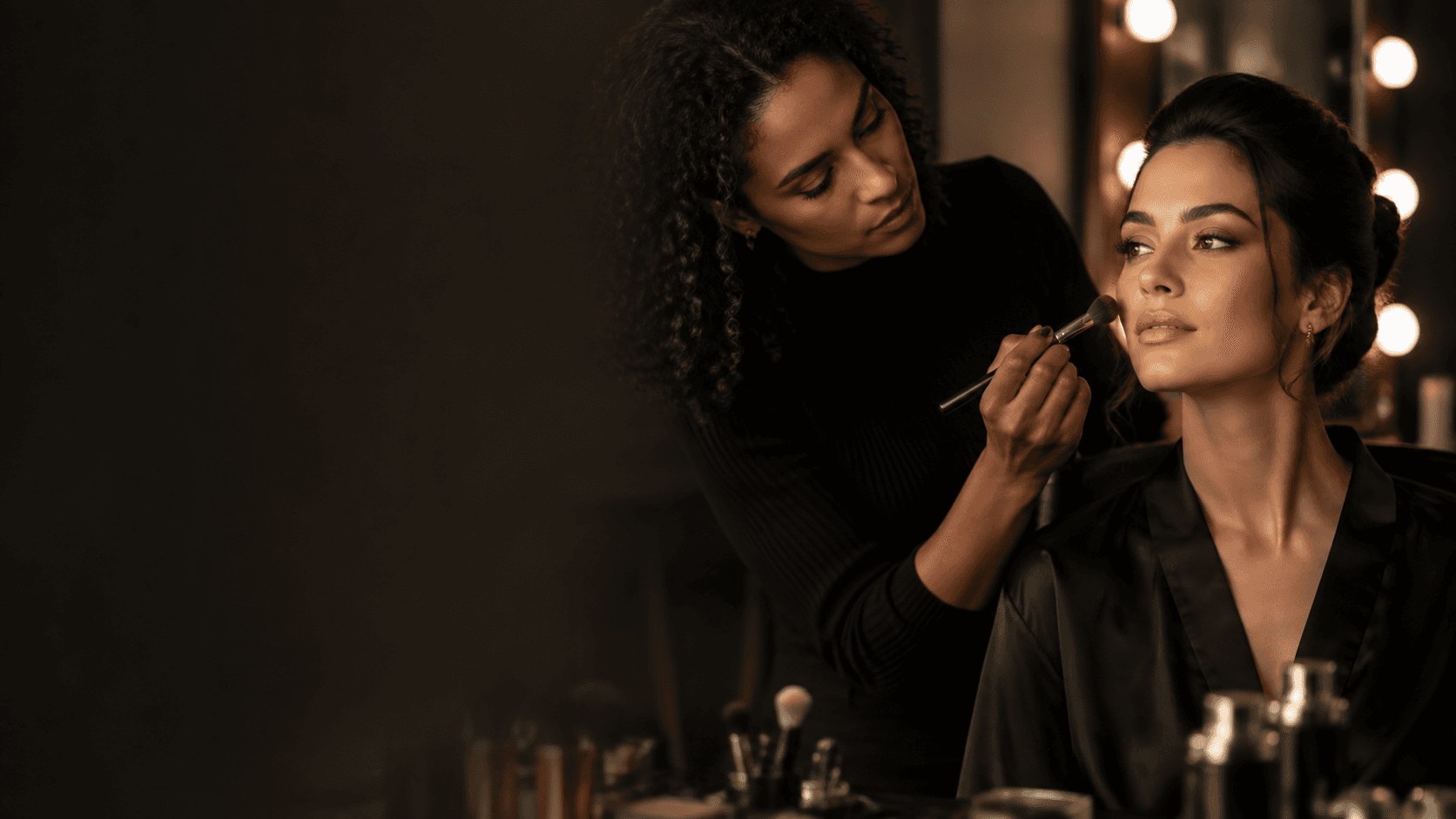Makeup artist preparing a client for an editorial shoot